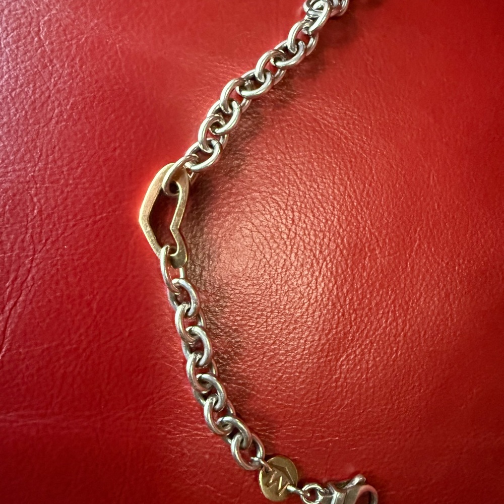 Movado Sterling Silver and 18k Gold Open Heart Bracelet.